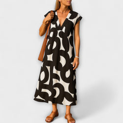 Tirzah - Elegante V-hals Jurk met Geometrische Print