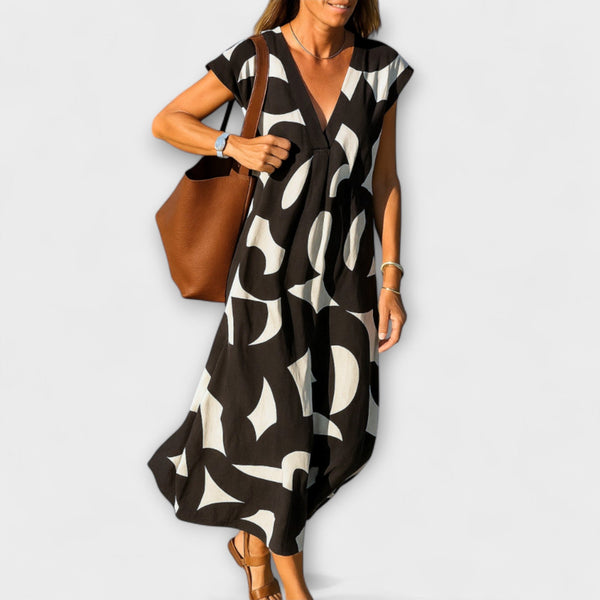 Tirzah - Elegante V-hals Jurk met Geometrische Print