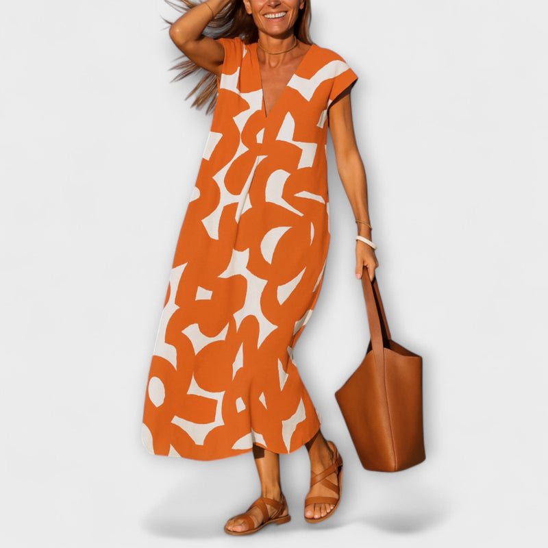Tirzah - Elegante V-hals Jurk met Geometrische Print